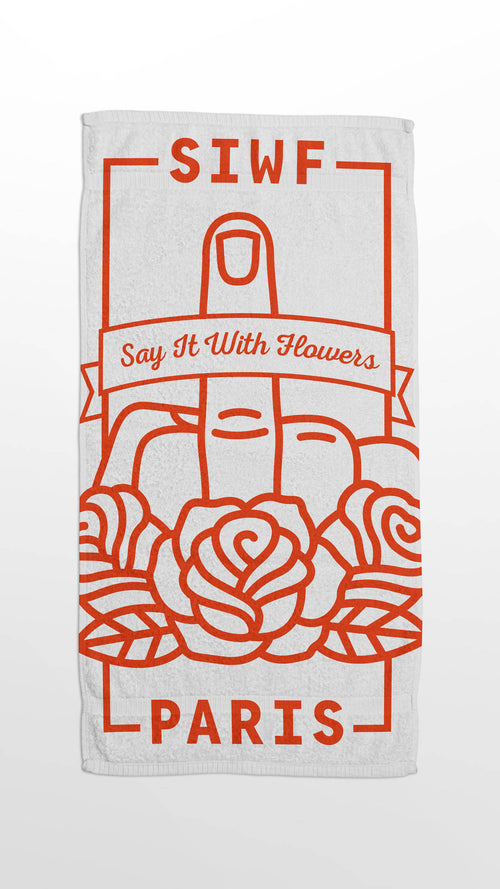 SIWF white beach towel with a red raised middle finger and roses emblem